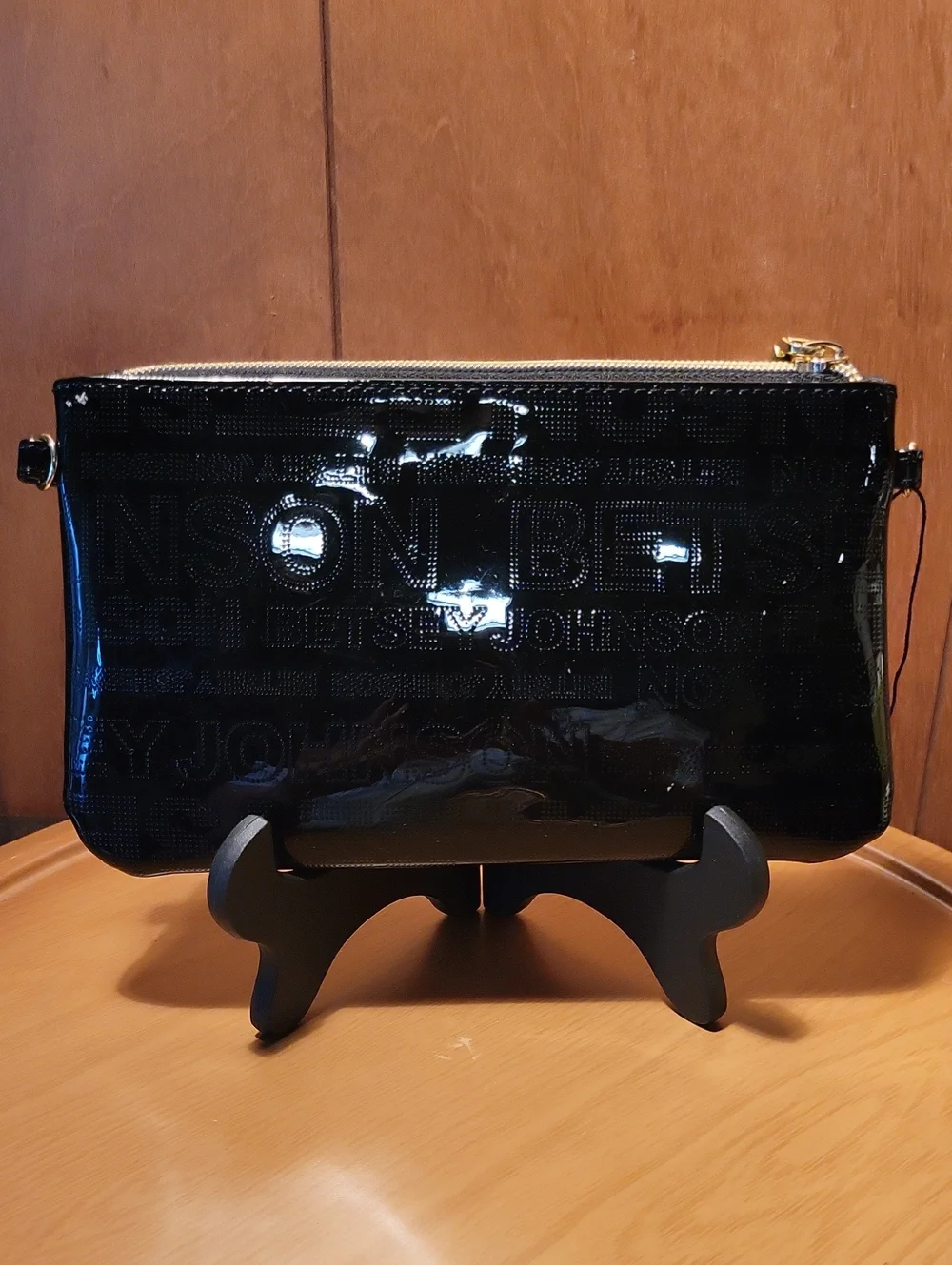 Betsey Johnson Black Patent Wristlet with Gold Accents and Cell Phone Charger